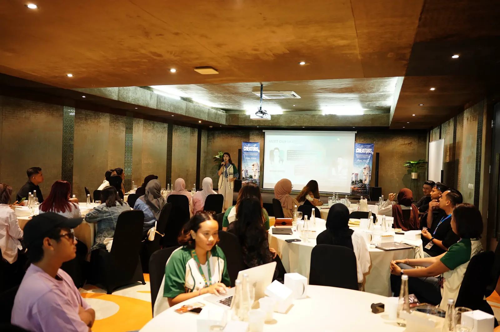 Workshop participants seated at round tables at Casablanca Meeting Room